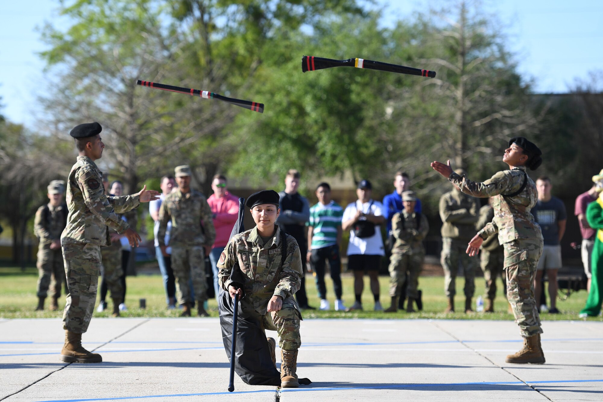 Members of the 335th Training Squadron freestyle drill team perform during the 81st Training Group drill down on the Levitow Training Support Facility drill pad at Keesler Air Force Base, Mississippi, April 1, 2022. Keesler trains more than 30,000 students each year. While in training, Airmen are given the opportunity to volunteer to learn and execute drill down routines. (U.S. Air Force photo by Kemberly Groue)