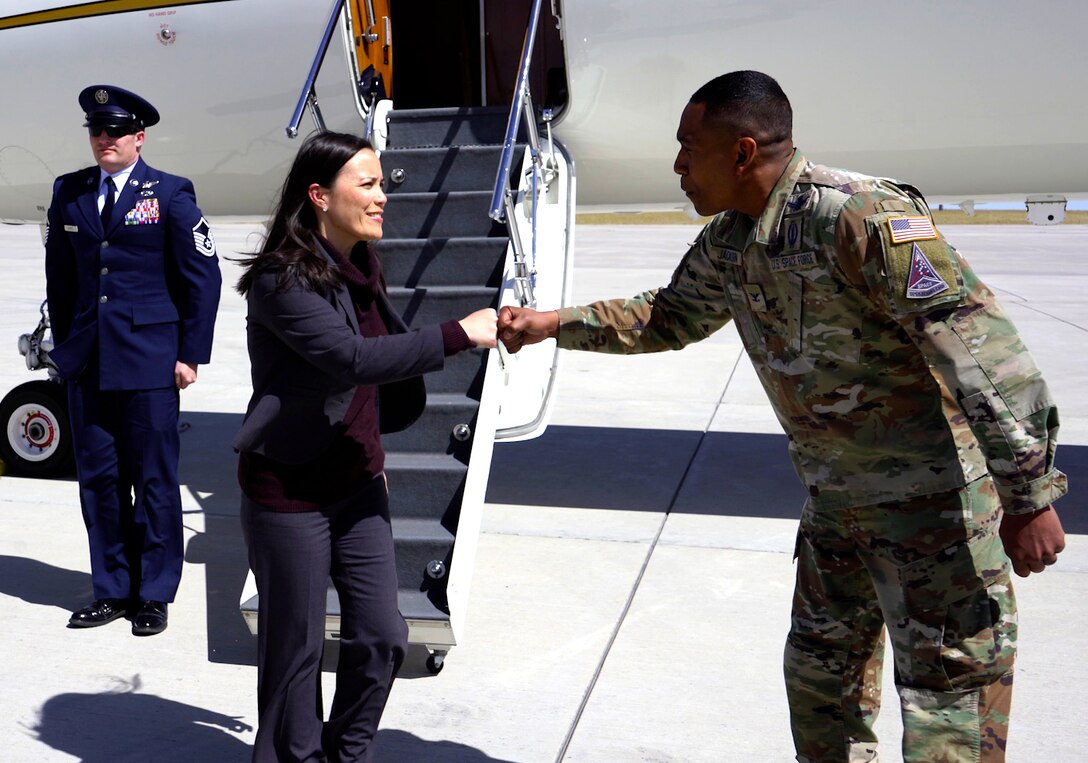 The Honorable Gina Ortiz Jones, Under Secretary of the Air Force, is greeted by Col. Marcus Jackson, the Buckley Garrison commander, at Buckley Space Force Base, Colo., April 4, 2022.