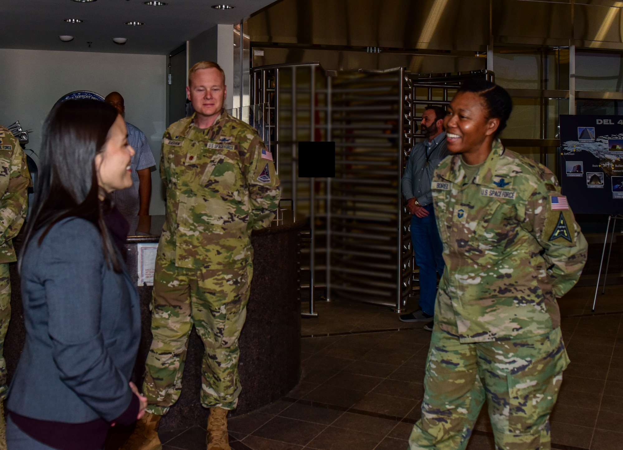 The Honorable Gina Ortiz Jones, Under Secretary of the Air Force, is greeted by Space Force members at the Mission Control Station lobby on Buckley Space Force Base, Colo., April 4, 2022.