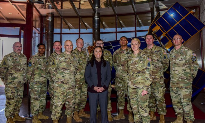 The Honorable Gina Ortiz Jones, Under Secretary of the Air Force, stands with Space Delta 4 members at the Mission Control Station lobby on Buckley Space Force Base, Colo., April 4, 2022.