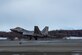A photo of an F-22 Raptor taking off from Ted Stevens Anchorage International Airport.