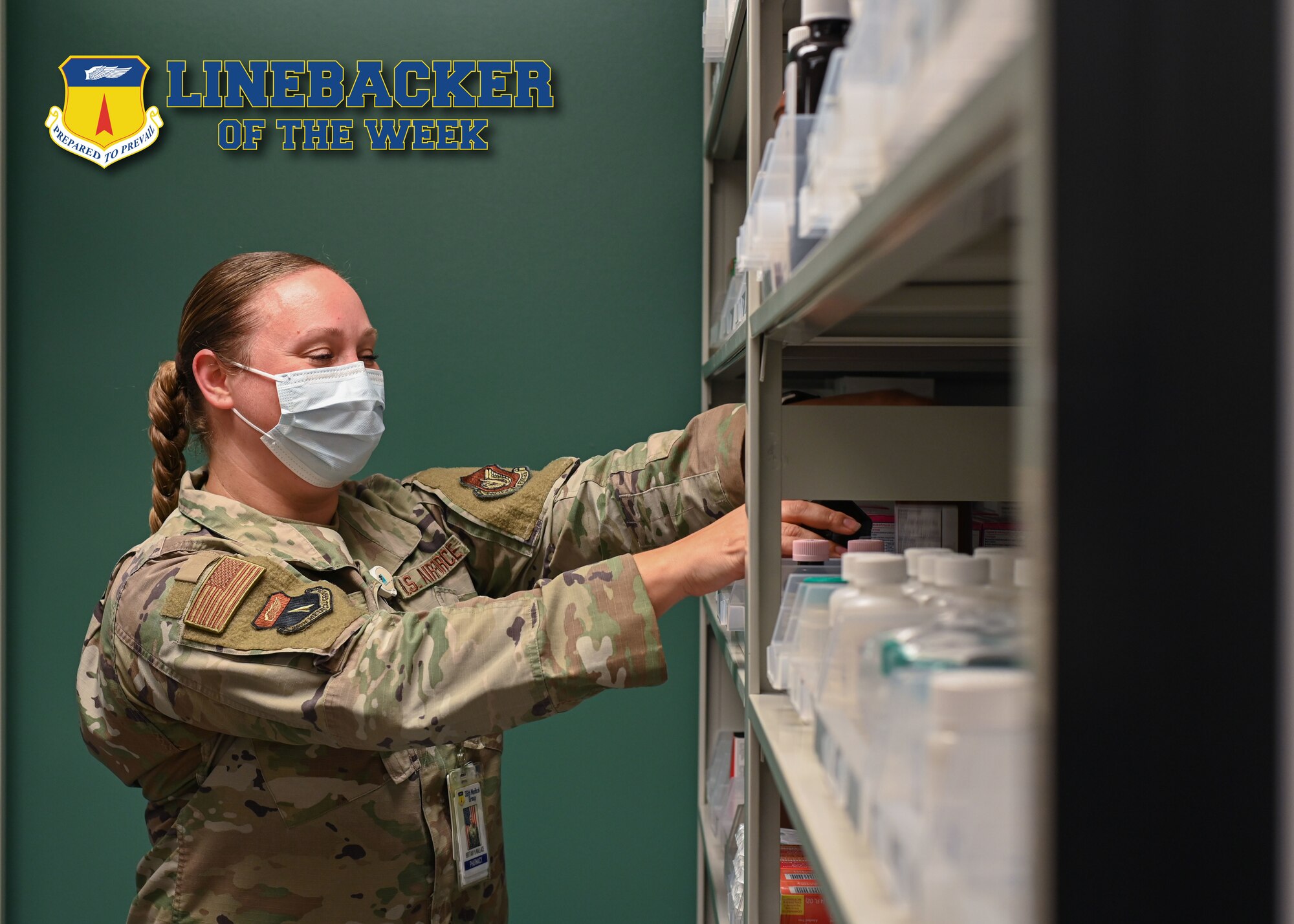 U.S. Air Force Tech. Sgt. Brittany Wallace, pharmacy flight chief of the 36th Healthcare Operations Squadron, puts prescriptions away at Andersen Air Force Base, Guam, April 5, 2022.