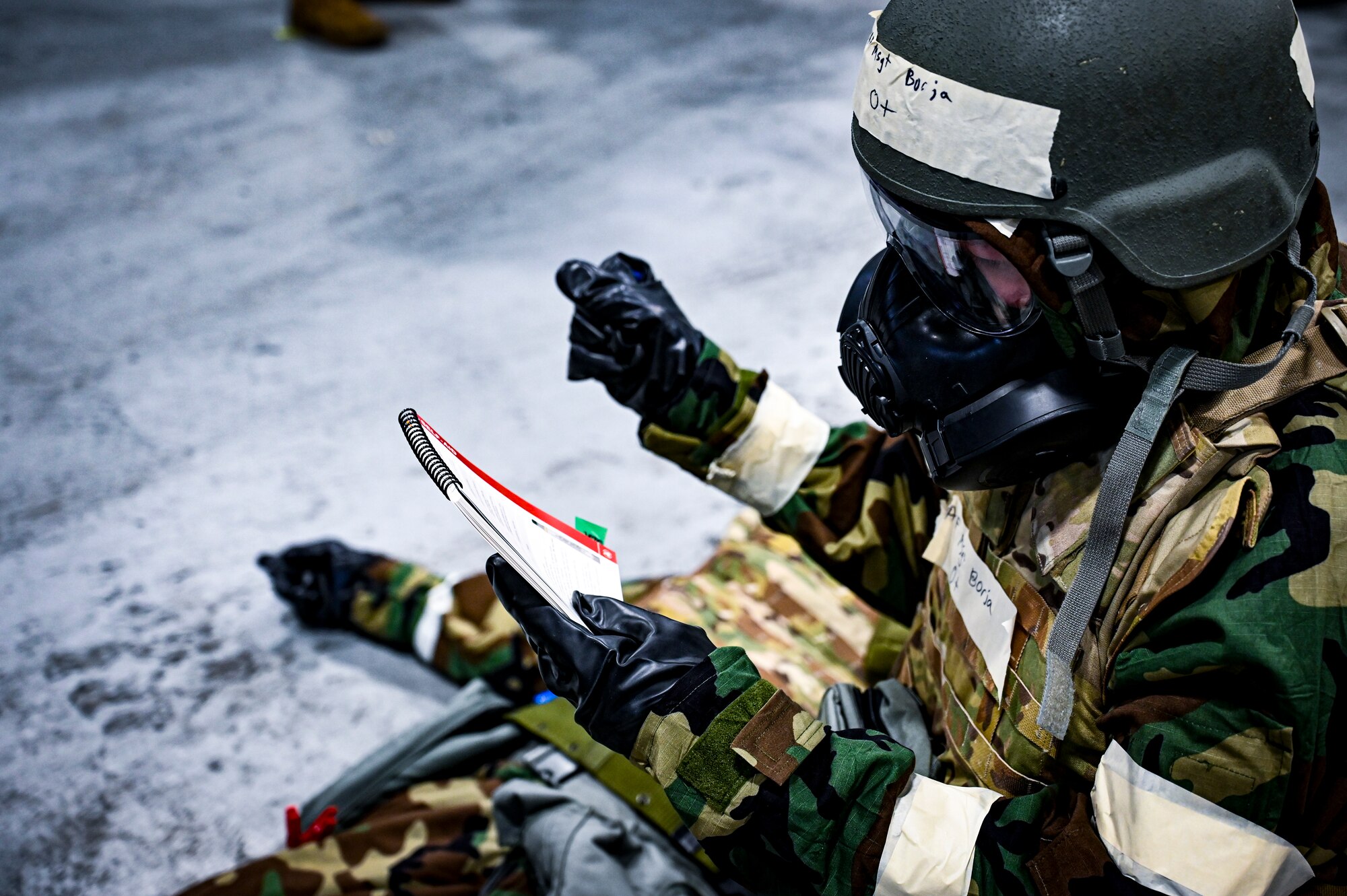 A U.S. Air Force Airman from the 305th Air Mobility Wing simulates chemical exposure treatment on another Airman, demonstrating the ability to survive and operate in a contested environment during a readiness exercise at Joint Base McGuire-Dix-Lakehurst, New Jersey, Apr. 3, 2022. Training exercises reinforce Airmen readiness and deliberately strengthen Air Mobility Command’s warfighting culture in order to provide unrivaled Rapid Global Mobility capable of protecting and sustaining the Joint Force.