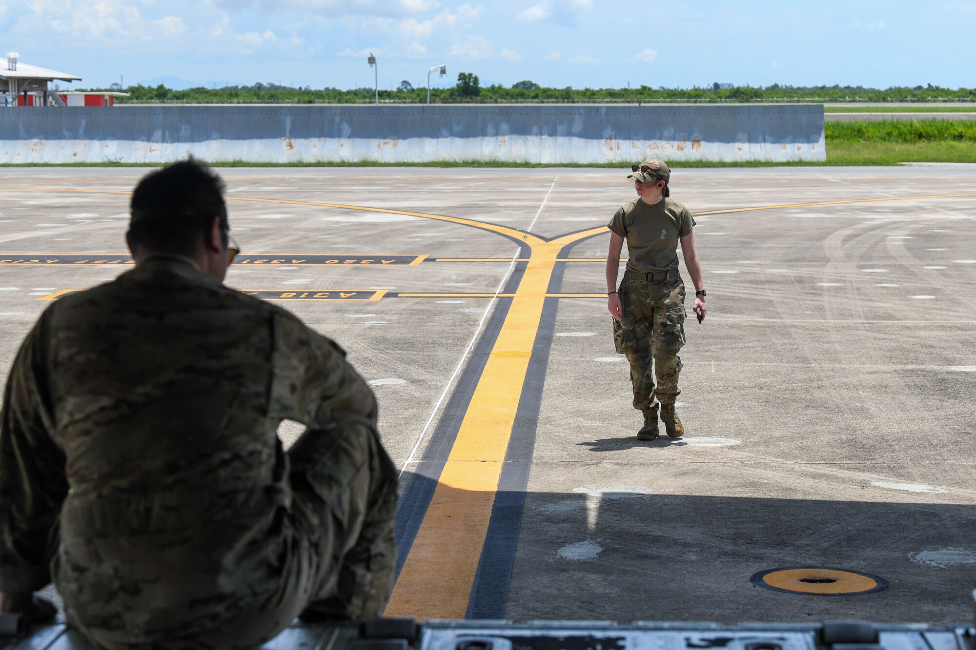 Airman walks on a flightline