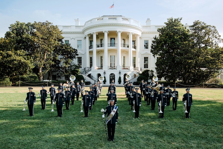 Air Force Marching band standing in front of white house