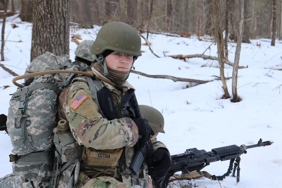 An ROTC student is dressed in an Army camouflage uniform with snow on the ground
