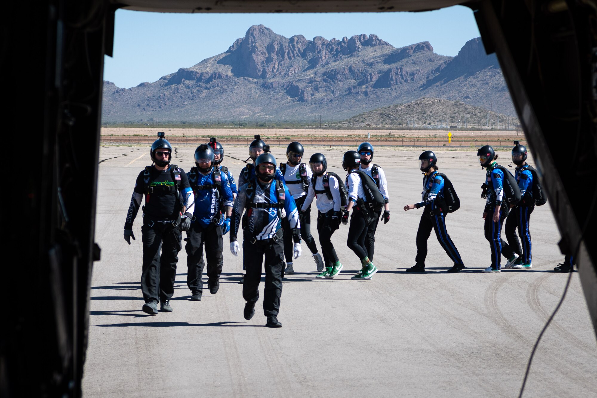 Wings of Blue members board a CV-22 Osprey.
