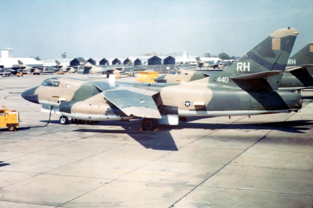 Two reconnaissance aircraft sit on tarmac.