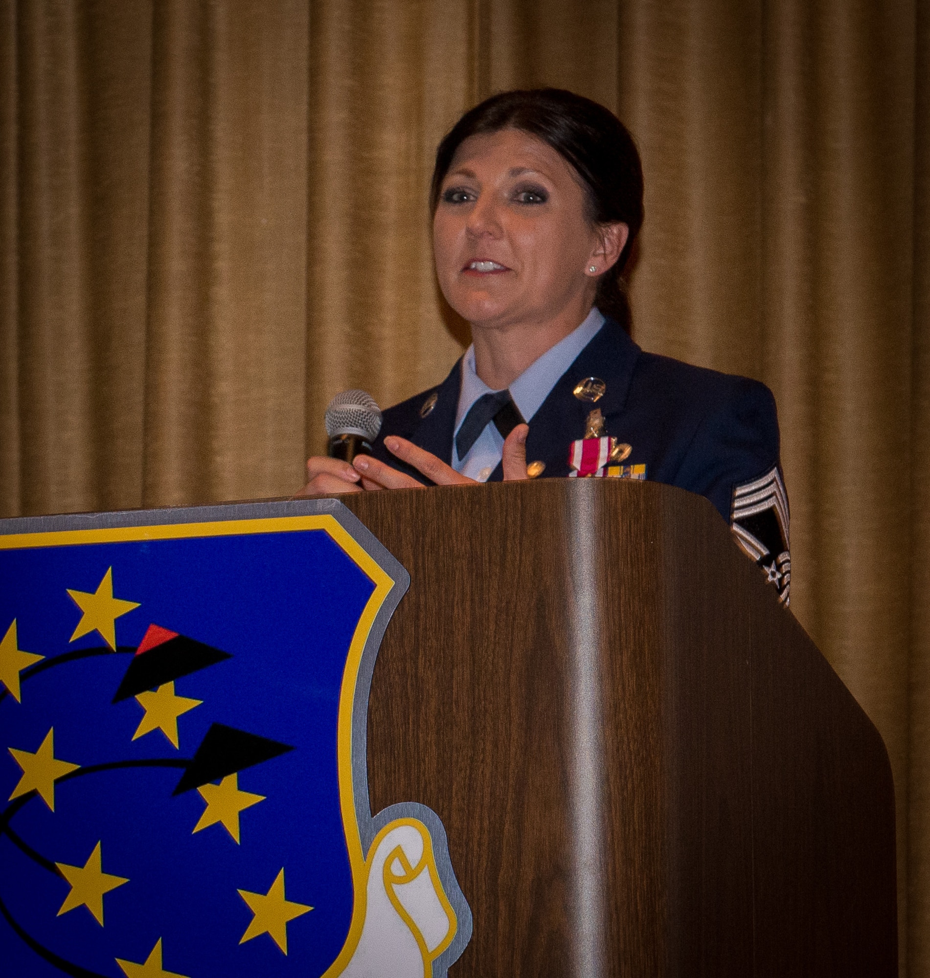 Chief Master Sgt. Kristy Long, 44th Fighter Group senior enlisted leader, addresses attendees at her retirement ceremony at Eglin AFB, April 1. She shared challenges, victories and her gratitude to her Airmen, family and friends for their support. (U.S. Air Force photo by Master Sgt. Jeremy Roman)