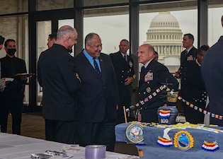 WASHINGTON (Apr. 6, 2022) Chief of Naval Operations (CNO) Adm. Mike Gilday speaks to Secretary of the Navy Carlos Del Toro, middle, and Rear Adm. Doug Verissimo, left, during the Centennial of Carrier Aviation Reception at the U.S. Capitol. Gilday explained that for 100 years aircraft carriers have been the most survivable and versatile airfields in the world. (U.S. Navy photo by Mass Communication Specialist 1st Class Sean Castellano/Released)