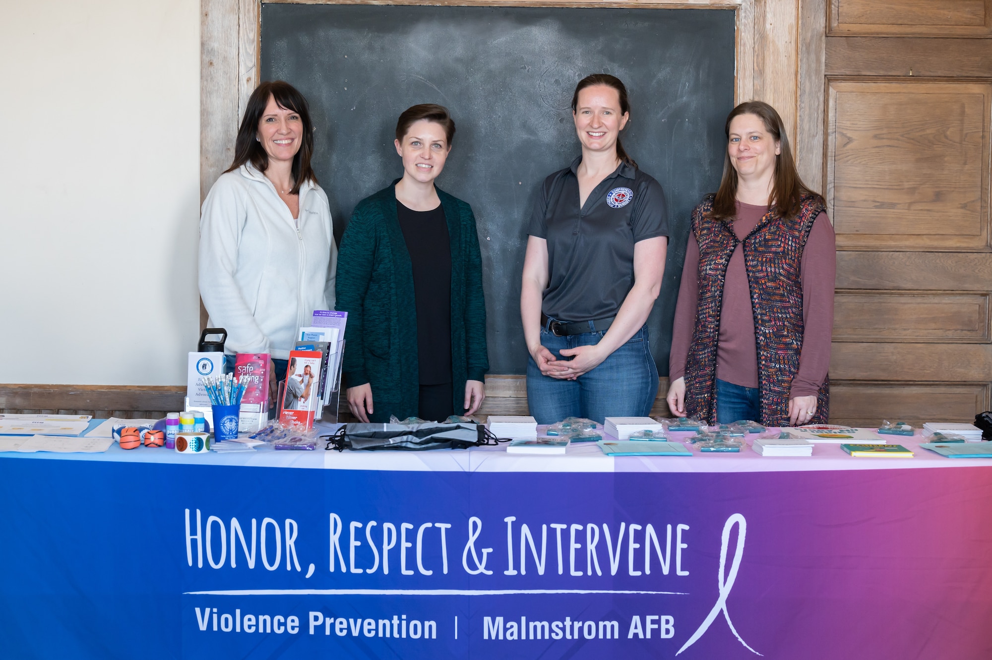 From left, Charla Dean, 341st Operational Medical Readiness Squadron victim advocate; Chelsea Garson, 341st OMRS family advocacy nurse; Serena Sargent, 341st Missile Wing violence prevention integrator; and Michelle Johnston, 341st MW sexual assault prevention coordinator, pose for a photo April 4, 2022, at the Paris Gibson Square Museum of Art in Great Falls, Mont.