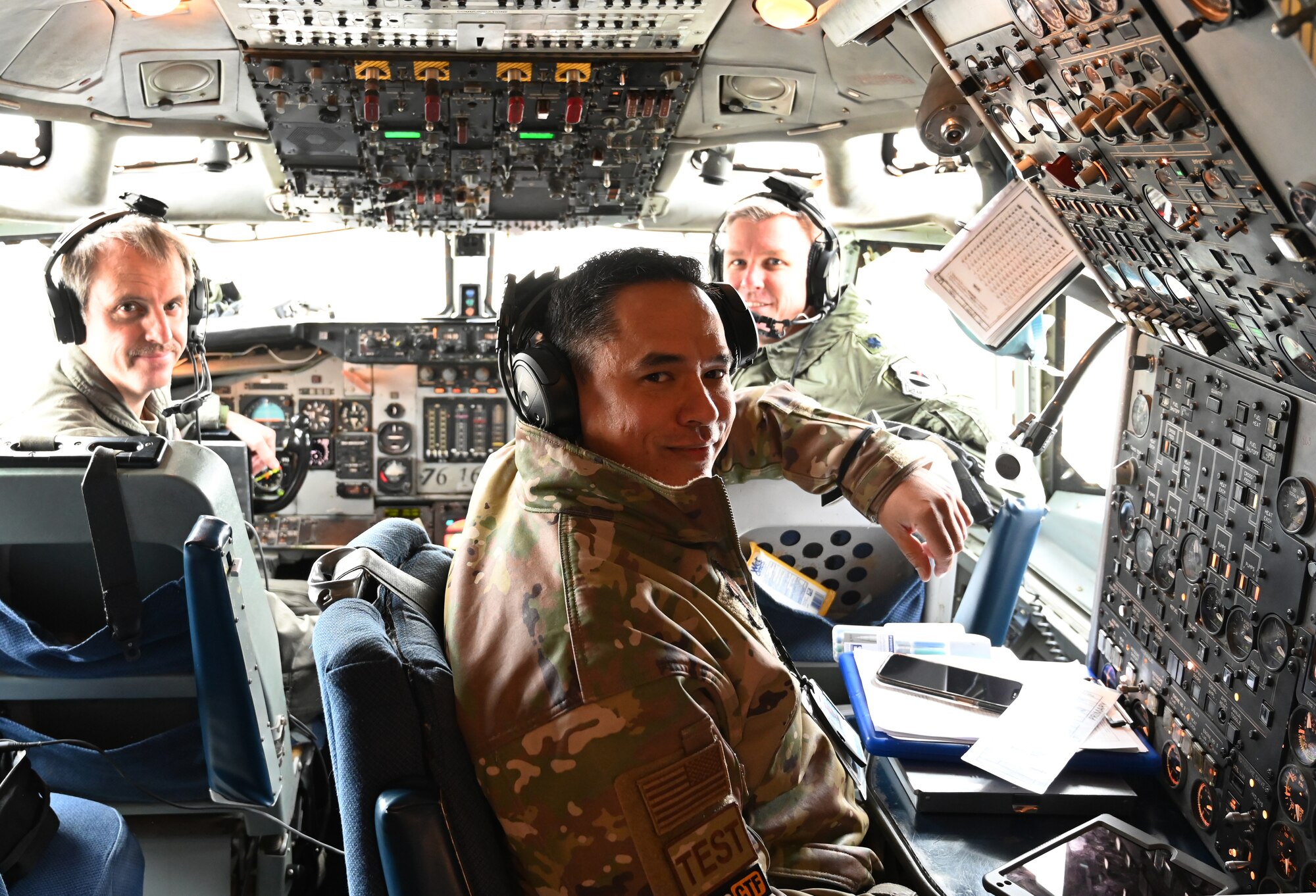 photo of three U.S. Air Force Airmen on AWACS E-3G