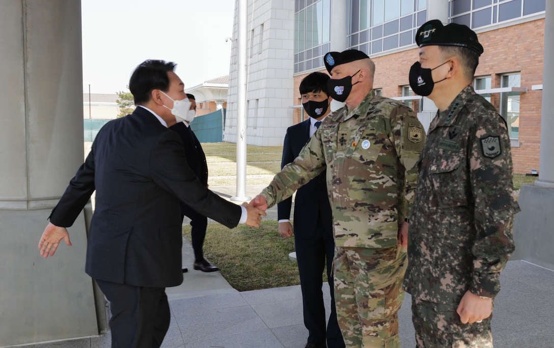 Republic of Korea President-elect Yoon, Suk-yeol greets Gen. Paul J. LaCamera, United Nations Command, Combined Forces Command, U.S. Forces Korea Commander, and ROK Gen. Kim, Seung-kyum, CFC Deputy Commander at Camp Humphreys, Republic of Korea, April 7, 2022. President-elect Yoon visited Humphreys to receive an overview of UNC/CFC/USFK’s ironclad commitment to strengthening the US-ROK Alliance and providing a strong robust combined defense posture to maintaining peace, security, and stability of the Korean peninsula. (U.S. Army photo by Staff Sgt. Kris Bonet)