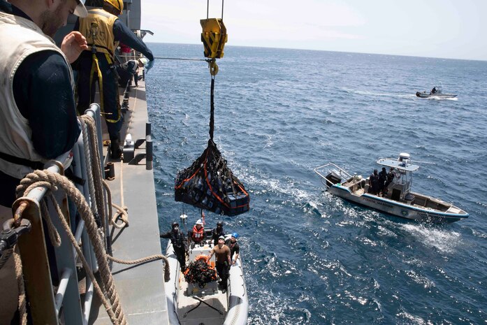 220406-N-TI693-1214

ATLANTIC OCEAN (April 6, 2022) - Sailors assigned to the Expeditionary Sea Base USS Hershel "Woody" Williams (ESB 4), lower seized contraband into a rigid-hull inflatable boat for transport to the Cabo Verdean authorities, April 6, 2022. Hershel "Woody" Williams is on a scheduled deployment in the U.S. Sixth Fleet area of operations in support of U.S. national interests and security in Europe and Africa. (U.S. Navy photo by Mass Communication Specialist 1st Class Fred Gray IV/Released)