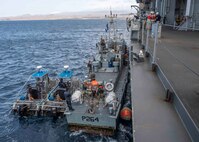 220406-N-TI693-1083

ATLANTIC OCEAN (April 6, 2022) - The Cabo Verdean authorities pull alongside the Expeditionary Sea Base USS Hershel "Woody" Williams (ESB 4), to receive seized contraband and detainees following maritime security operations with Cabo Verde, April 6, 2022. Hershel "Woody" Williams is on a scheduled deployment in the U.S. Sixth Fleet area of operations in support of U.S. national interests and security in Europe and Africa. (U.S. Navy photo by Mass Communication Specialist 1st Class Fred Gray IV/Released)