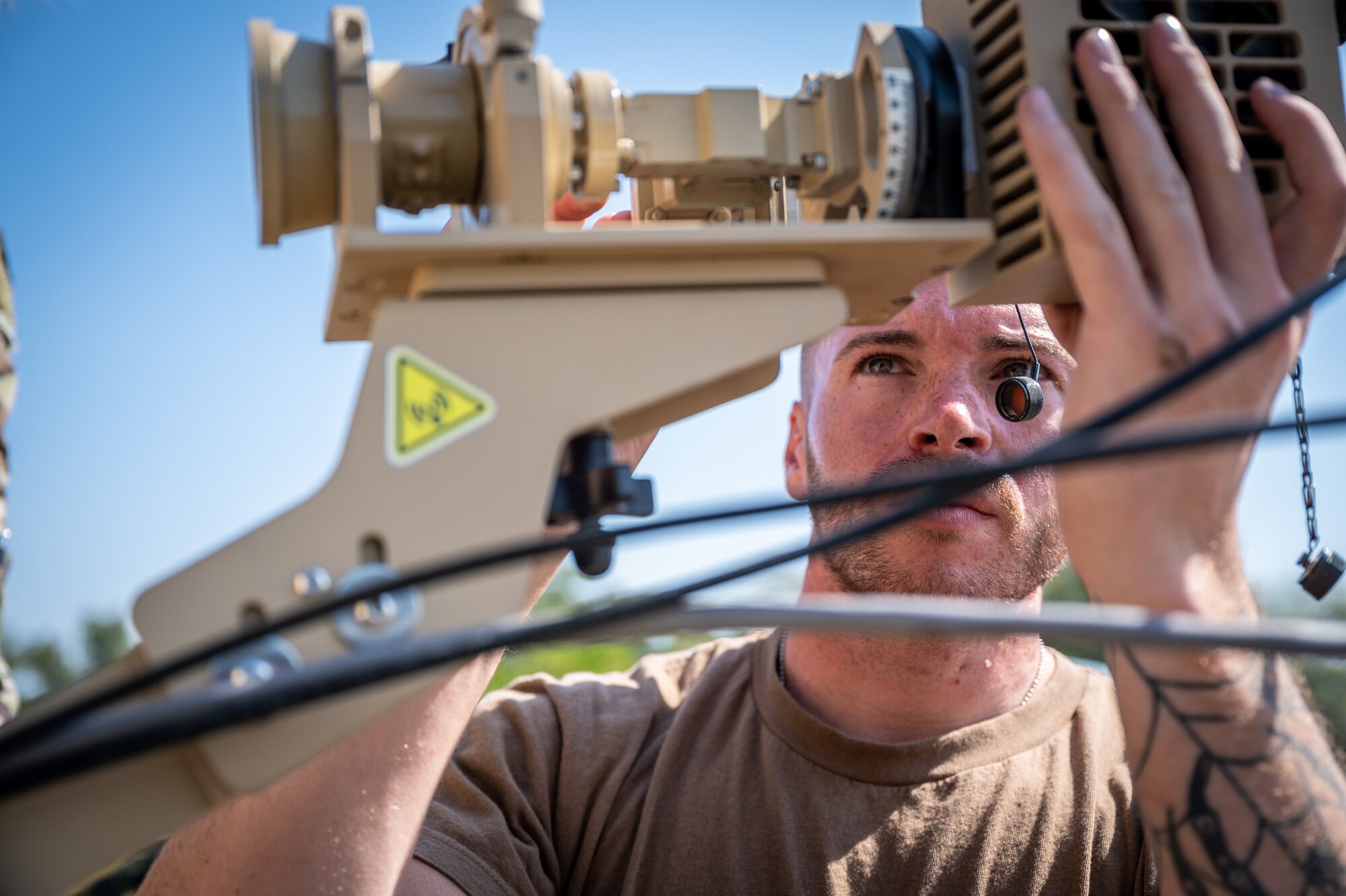 Staff Sgt. Benjamin Wilson, 332d Expeditionary Communications Squadron network infrastructure supervisor, sets up an antenna system for a communications fly-away kit at a Pakistan operational air force base, Feb. 27, 2022. The kit allowed U.S. Air Force members from across the Air Forces Central area of responsibility to manage communications while supporting Falcon Talon 2022, an Agile Combat Employment operation and the first bilateral training event between the United States and Pakistan since 2019. (U.S. Air Force photo by Master Sgt. Christopher Parr)