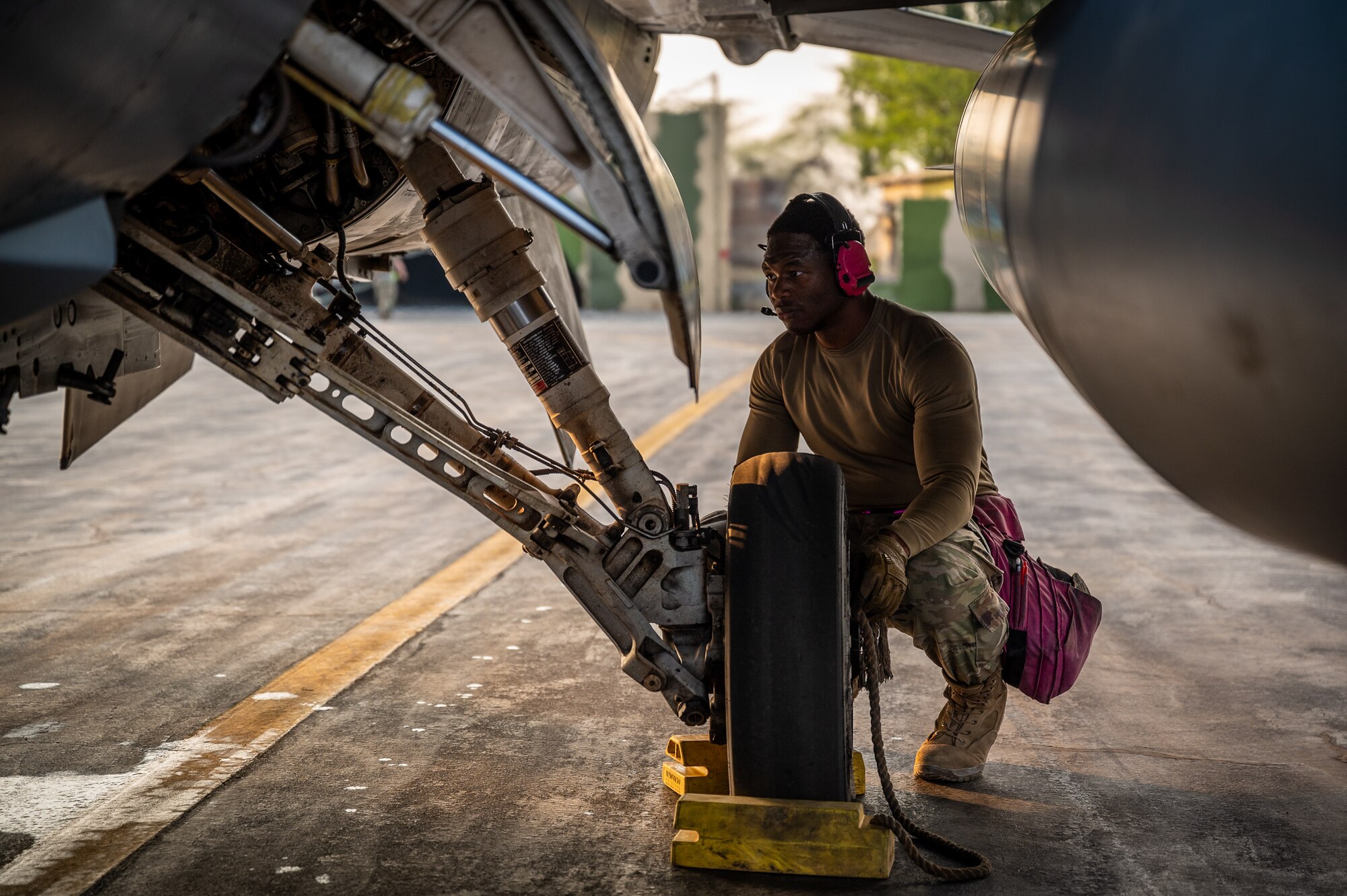 Staff Sgt. Avary Kemp, 55th Expeditionary Fighter Generation Squadron weapons load crew member, performs an end of runway inspection on a 55th Expeditionary Fighter Squadron F-16 Fighting Falcon aircraft after landing at a Pakistan operational air force base, Feb. 26, 2022. Kemp, along with other U.S. Air Force members from across the Air Forces Central area of responsibility, deployed to Pakistan in support of Falcon Talon 2022. This Agile Combat Employment operation is the first bilateral training event between the United States and Pakistan since 2019. (U.S. Air Force photo by Master Sgt. Christopher Parr)