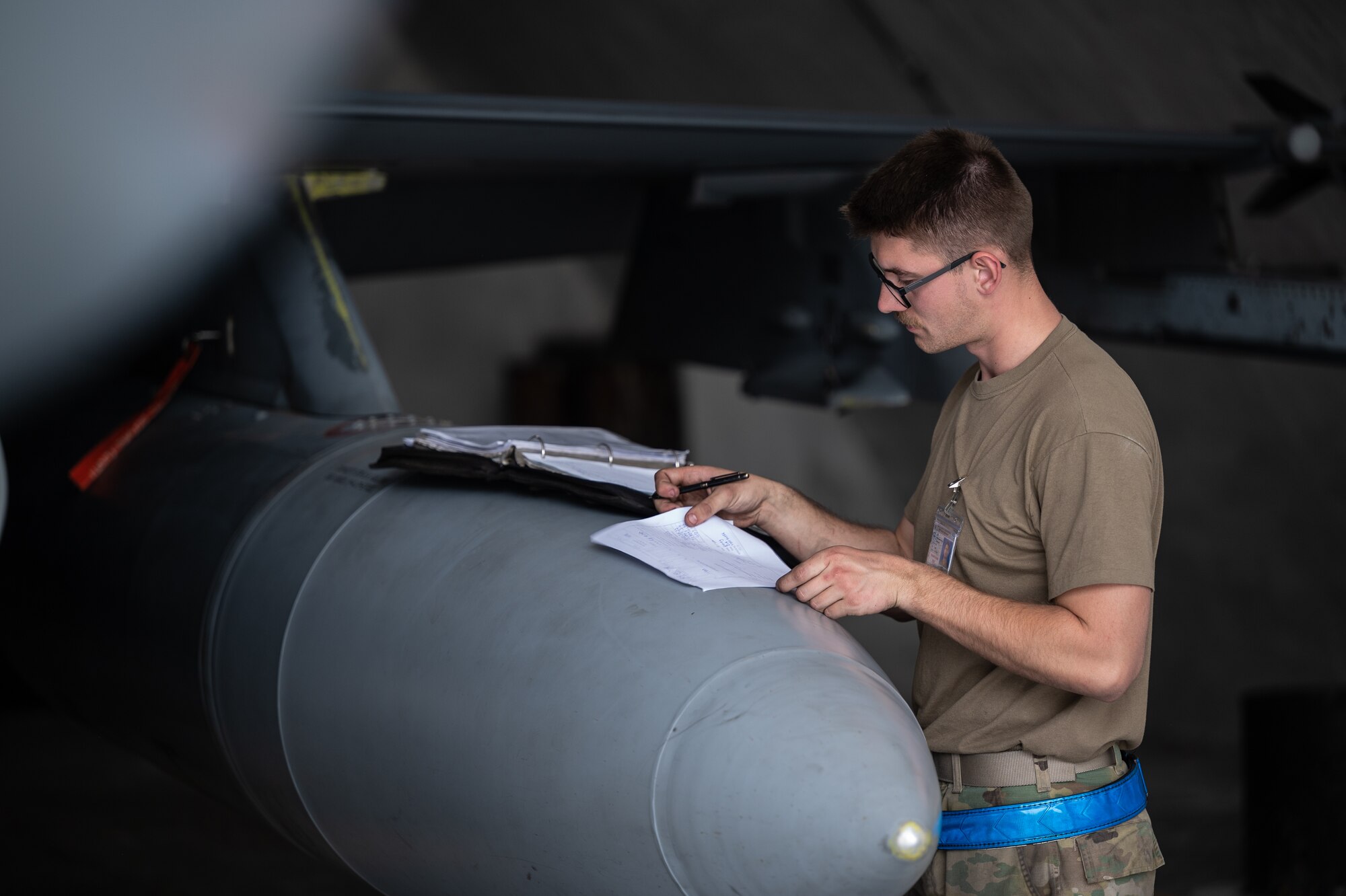 Senior Airman Beau Pavey, 55th Expeditionary Fighter Generation Squadron engine journeyman, documents post-flight inspection notes following a U.S. Air Force F-16 Fighting Falcon training sortie March 2, 2022 during Falcon Talon 2022. This Agile Combat Employment operation is the first bilateral training event between the United States and Pakistan since 2019. (U.S. Air Force photo by Master Sgt. Christopher Parr)