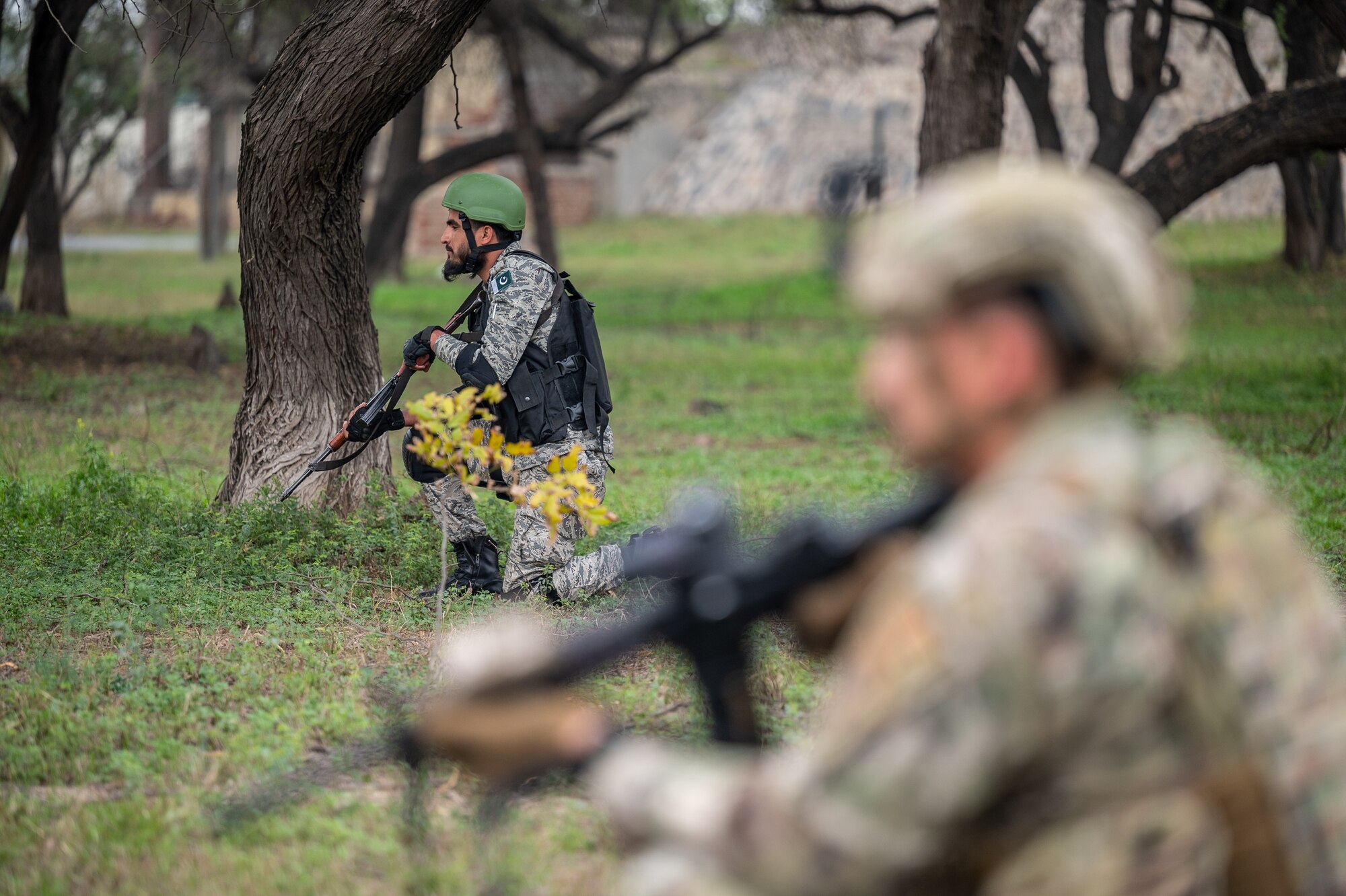 Airmen from the U.S. and Pakistan Air Forces work together during a joint fire and maneuver training scenario at a PAF operational base, March 2, 2022, during Falcon Talon 2022. The Agile Combat Employment operation is the first bilateral training event between the two countries since 2019. (U.S. Air Force photo by Master Sgt. Christopher Parr)