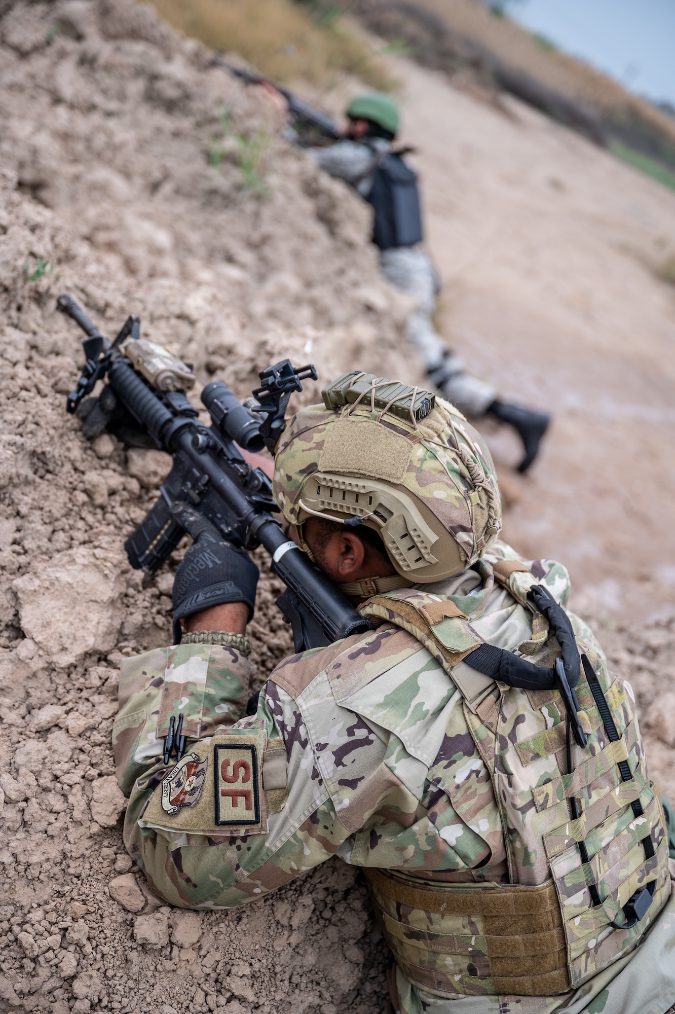 Airmen from the U.S. and Pakistan Air Forces work together during a joint fire and maneuver training scenario at a PAF operational base, March 2, 2022, during Falcon Talon 2022. The Agile Combat Employment operation is the first bilateral training event between the two countries since 2019. (U.S. Air Force photo by Master Sgt. Christopher Parr)