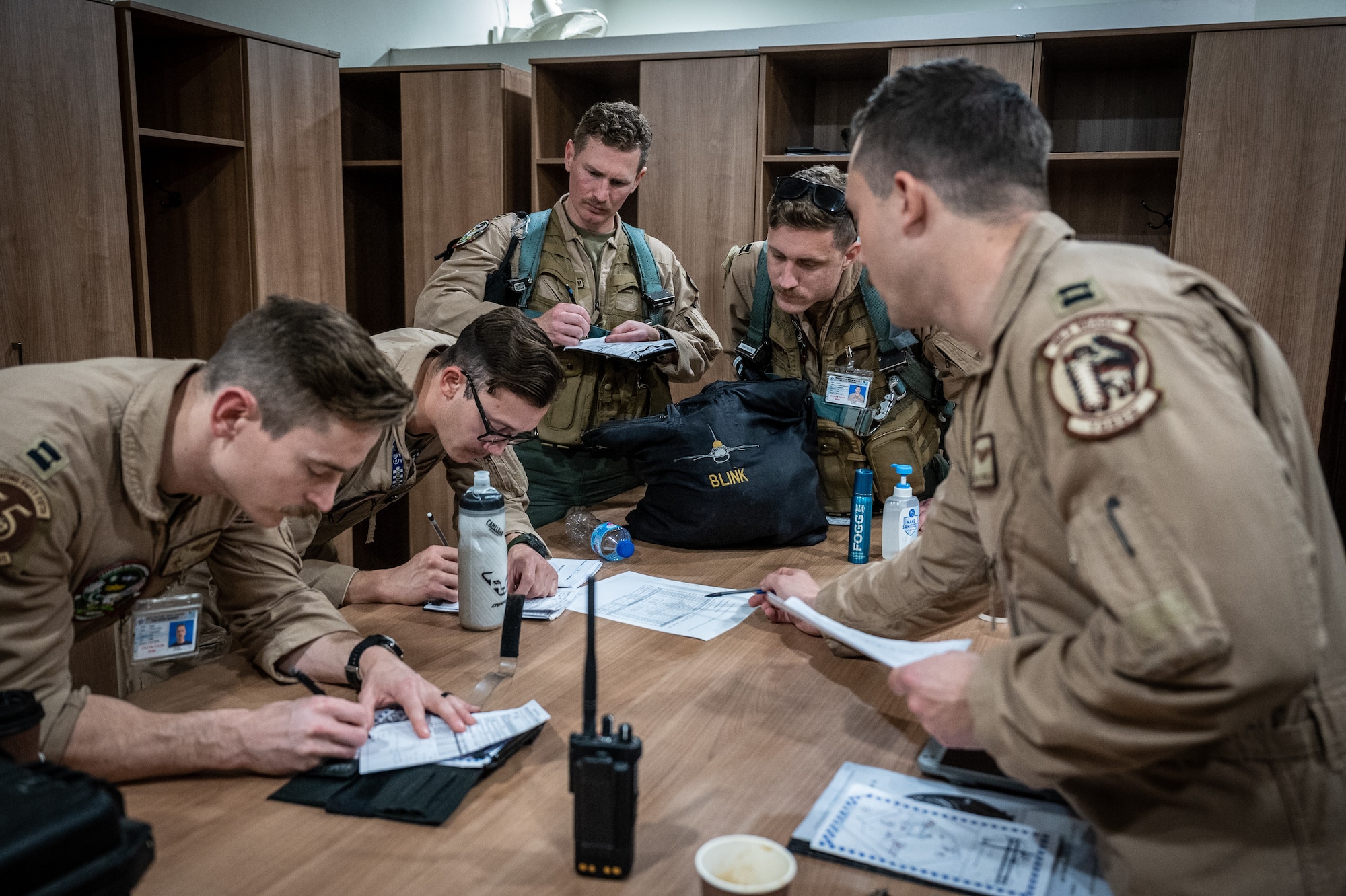332d Air Expeditionary Wing F-16 Fighting Falcon aircraft pilots review a mission plan prior to launching a training sortie Feb. 28, 2022, with Pakistan Air Force partners during Falcon Talon 2022 at a PAF operational base. This Agile Combat Employment operation is the first bilateral training event between the United States and Pakistan since 2019. (U.S. Air Force photo by Master Sgt. Christopher Parr)