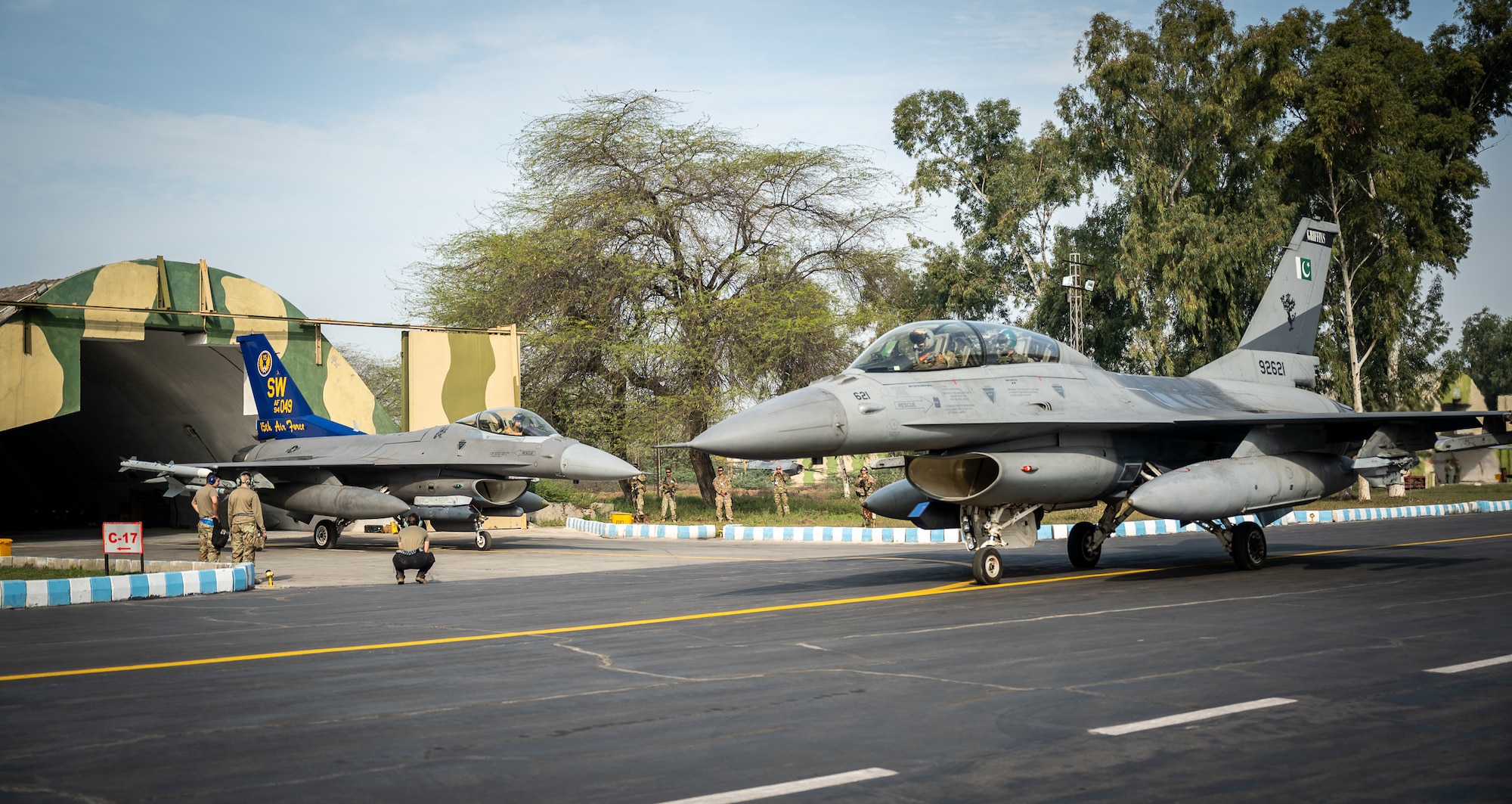 U.S. and Pakistan Air Force F-16s aircraft head out for a training sortie at a PAF operational base, Feb. 28, 2022. Falcon Talon 2022, an Agile Combat Employment operation, is the first bilateral training event between the United States and Pakistan since 2019. (U.S. Air Force photo by Master Sgt. Christopher Parr)