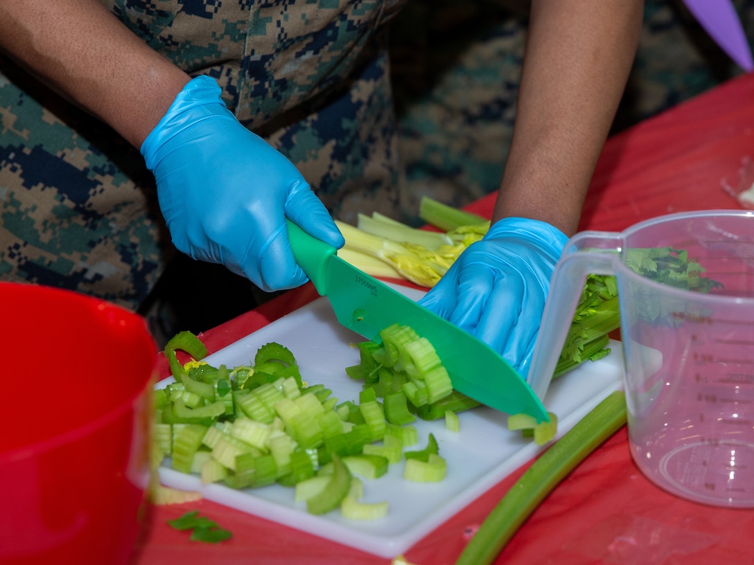 U.S. Marines participate in a cooking competition hosted by the Single Marine Program in partnership with the Defense Commissary Agency on Marine Corps Base Quantico, Virginia, March 31, 2022. The event included a cooking, shopping, and nutrition based course; practical application; and a cooking competition. During the competition, the Marines had one and a half hours to make a week's’ worth of breakfasts, lunches, dinners, and snacks using only an Instant Pot and microwave. (US Marine Corps photo by Lance Cpl. Kayla LaMar)
