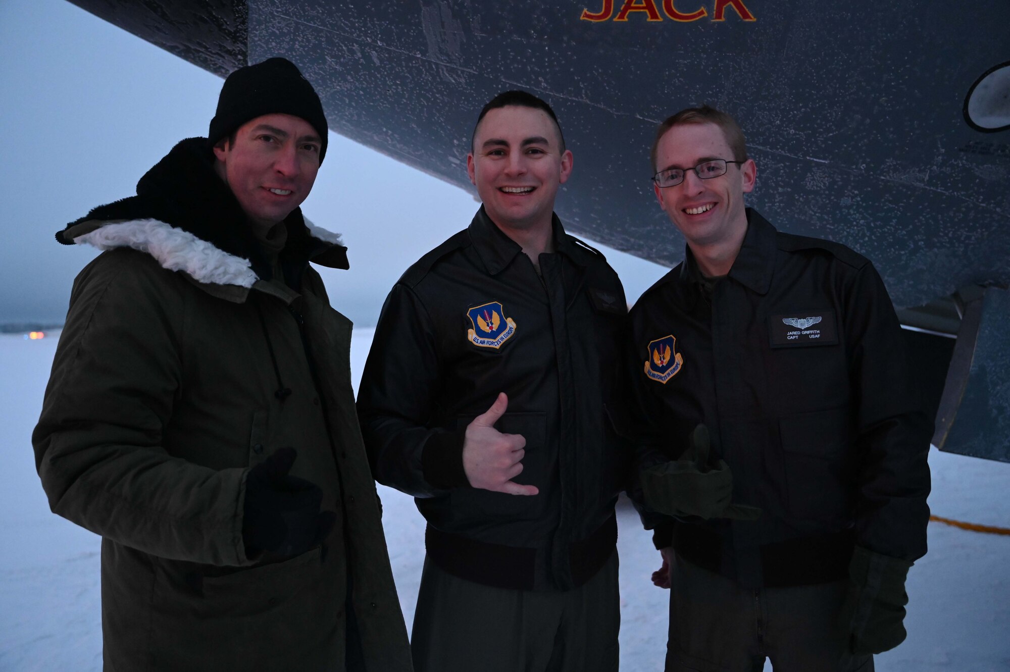 U.S. Air Force Maj. Bobby Strain, left, Maj. Jarrod Ebner, middle,  and Capt. Jared Griffith, 351st Air Refueling Squadron KC-135 Stratotanker aircraft pilots, perform a pre-flight brief prior to traveling to Rovianiemi, Finland for a refueling mission at Royal Air Force Mildenhall, England, Jan. 22, 2022. Ebner spent his birthday participating in a business effort between the 100th Air Refueling Wing and the Finnish Air Force. (U.S. Air Force photo by Airman 1st Class Viviam Chiu)
