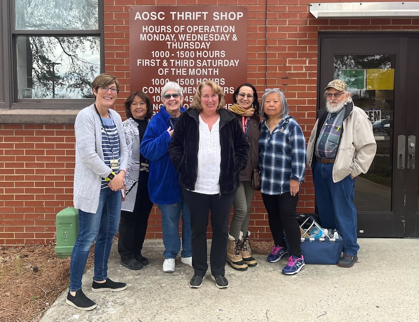 Members from the Andrews Spouses’ Club pose for a photo in front of the ASC Thrift Shop on Joint Base Andrews, Md., April 5, 2022.