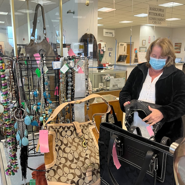 A member from the Andrews Spouses’ Club arranges bags at the ASC Thrift Shop on Joint Base Andrews, Md., April 5, 2022.