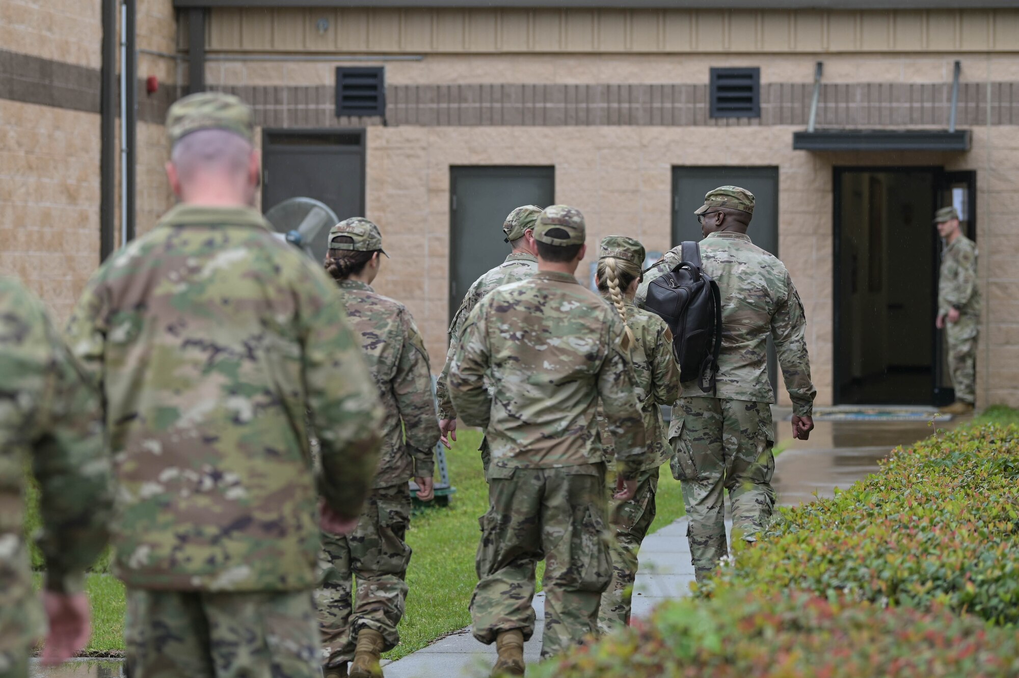 U.S. Air Force Tech. Sgt. Jeffrey Maxson, 23rd Security Forces Squadron noncommissioned officer in charge of combat arms, left, briefs Maj. Gen. Stacey Hawkins, Air Combat Command director of logistics, engineering and force protection, middle, and Chief Master Sgt. Lester Braithwaite, ACC A4 senior enlisted leader, right, about their initiatives to support Lead-Wing concepts March 24, 2022, at Moody Air Force Base, Georgia. The 23rd SFS is streamlining the way the combat arms staff trains and qualifies Immediate Response Force assigned personnel. (U.S. Air Force photo by Senior Airman Rebeckah Medeiros)