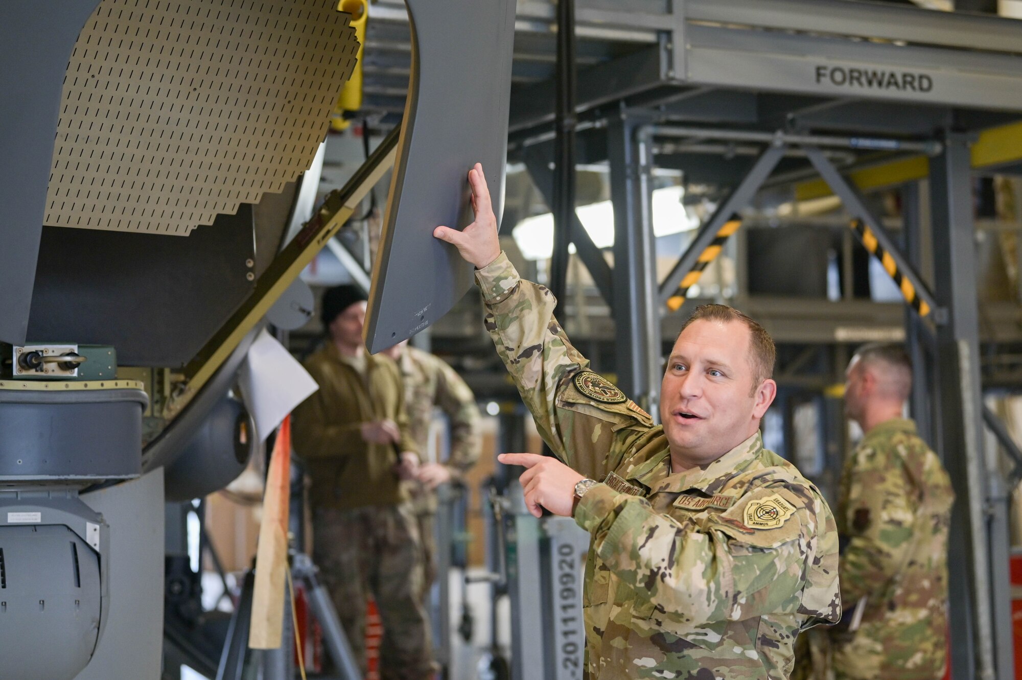 U.S. Air Force Chief Master Sgt. Lester Braithwaite, the senior enlisted leader of Air Combat Command directorate of logistics, engineering and force protection, points to an HC-130J Combat King II aircraft radar, March 25, 2022, at Moody Air Force Base, Georgia. Braithwaite worked in avionics for 16 years prior to becoming a command chief. (U.S. Air Force photo by Senior Airman Rebeckah Medeiros)