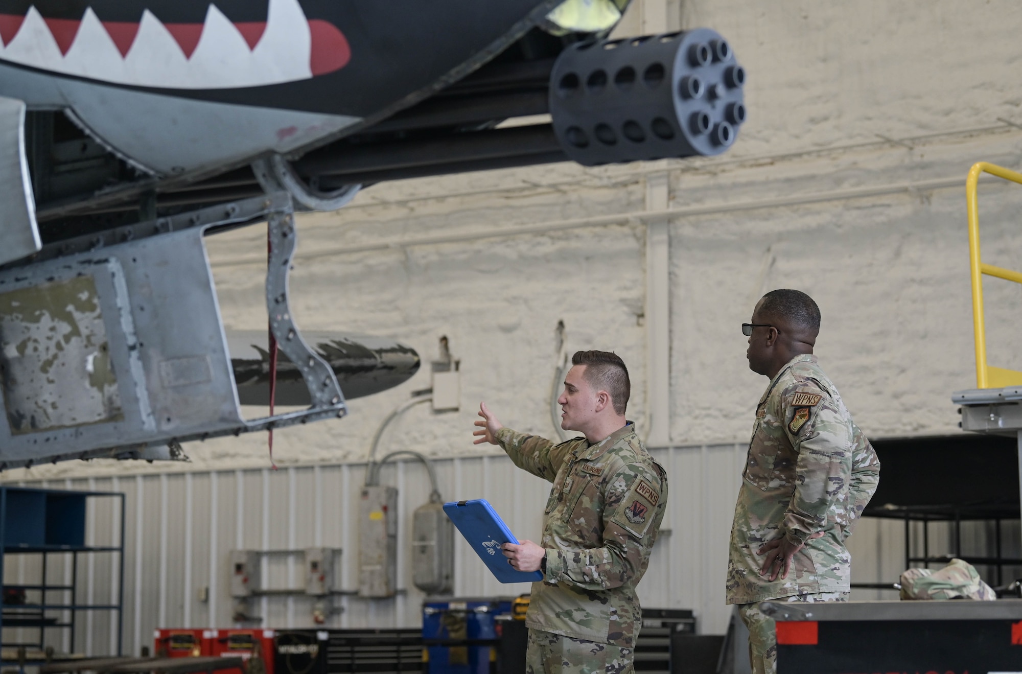 U.S. Air Force Tech. Sgt. Anthony Padilla Negron, 74th Fighter Generation Squadron weapons specialist, left, briefs Maj. Gen. Stacey Hawkins, Air Combat Command director of logistics, engineering and force protection, right, about the A-10C Thunderbolt II aircraft and the weapons system March 25, 2022, at Moody Air Force Base, Georgia. Hawkins visited the base as part of a familiarization tour and to see Moody’s role as an ACC Lead Wing. (U.S. Air Force photo by Senior Airman Rebeckah Medeiros)