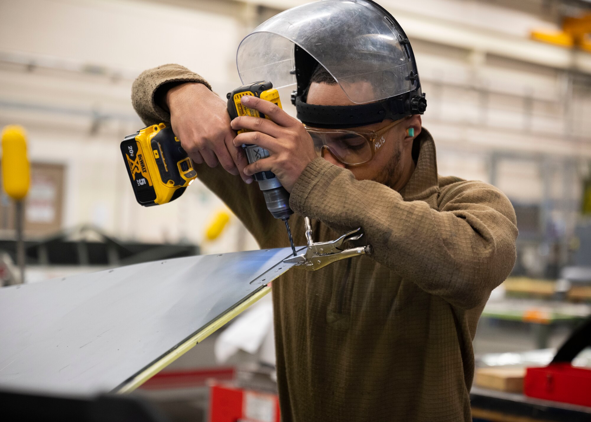 The Airmen work on the structural integrity of the aircraft to ensure continued operability.