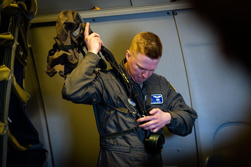 U.S. Staff Sgt. Kyle Agnor dons aircrew eye and respiratory protection system