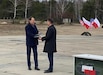 U.S. Ambassador to Poland Mark Brzezinski accepts the signed Foreign Military Sales case from Polish Minister of National Defence Mariusz Błaszczak for the purchase of Abrams tanks and other equipment at a ceremony in Wesola, Poland, April 5.