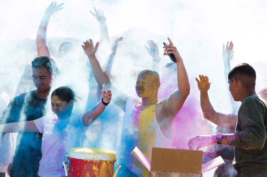 Participants in the Colorful Consent Run are covered in powder the conclusion of the Colorful Consent Run at Marine Air Ground Combat Center, Twentynine Palms, Calif., April 1. To begin the Sexual Assault Awareness month, members of the MCAGCC community participated in the Colorful Consent Run, a 3.2 mile run while having colorful powder thrown on them.