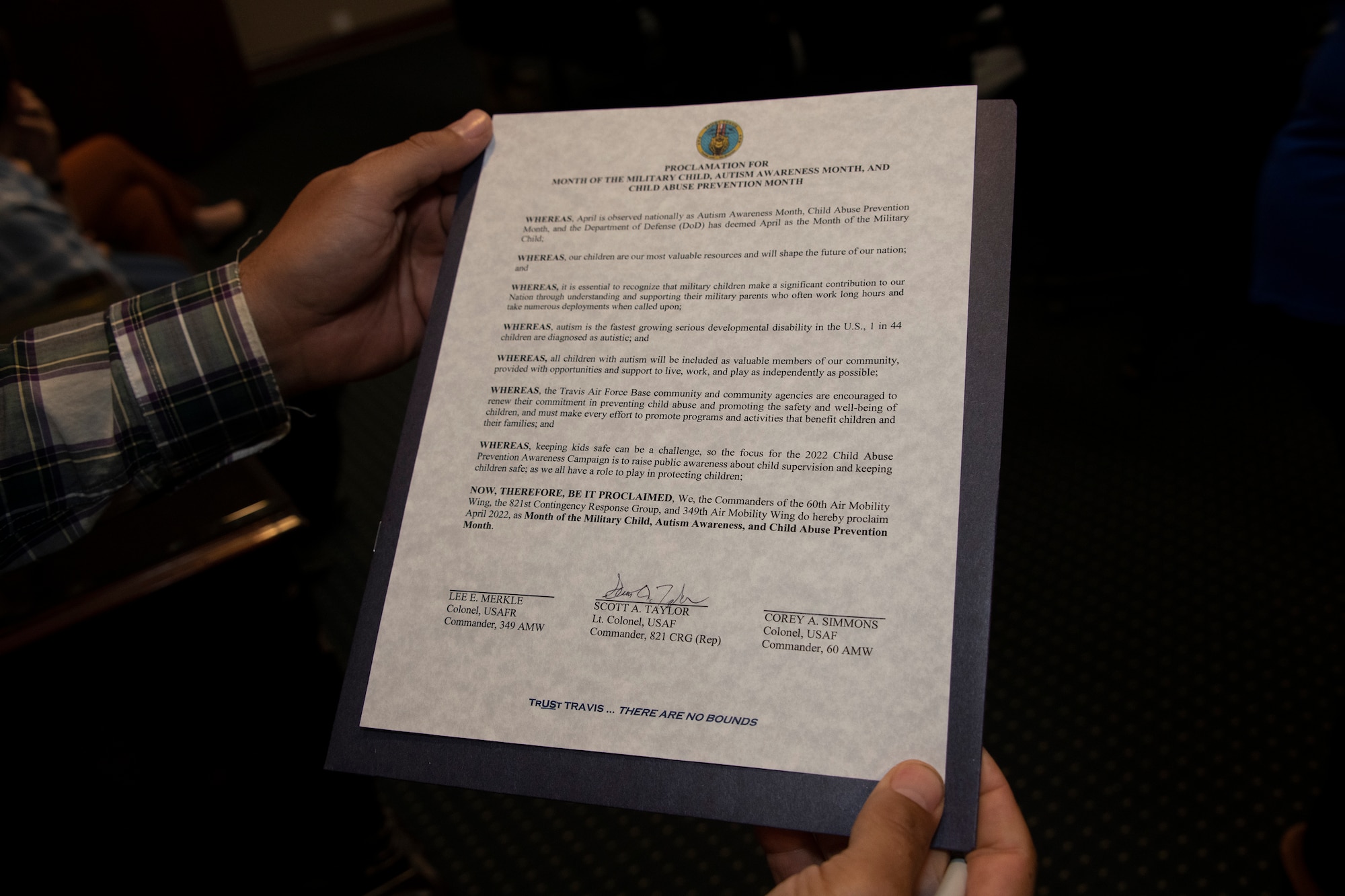 An autism awareness and child abuse prevention month proclamation is displayed