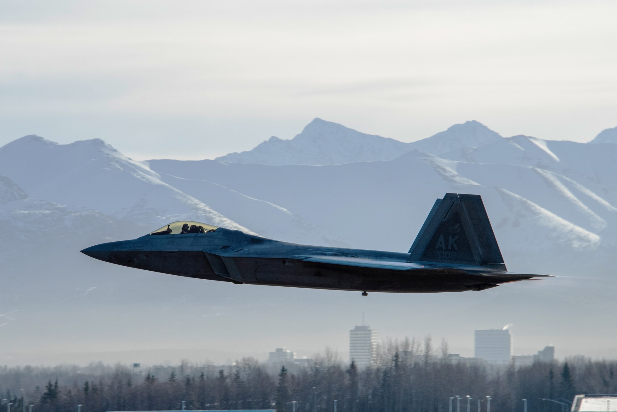 A photo of an F-22 Raptor taking off.