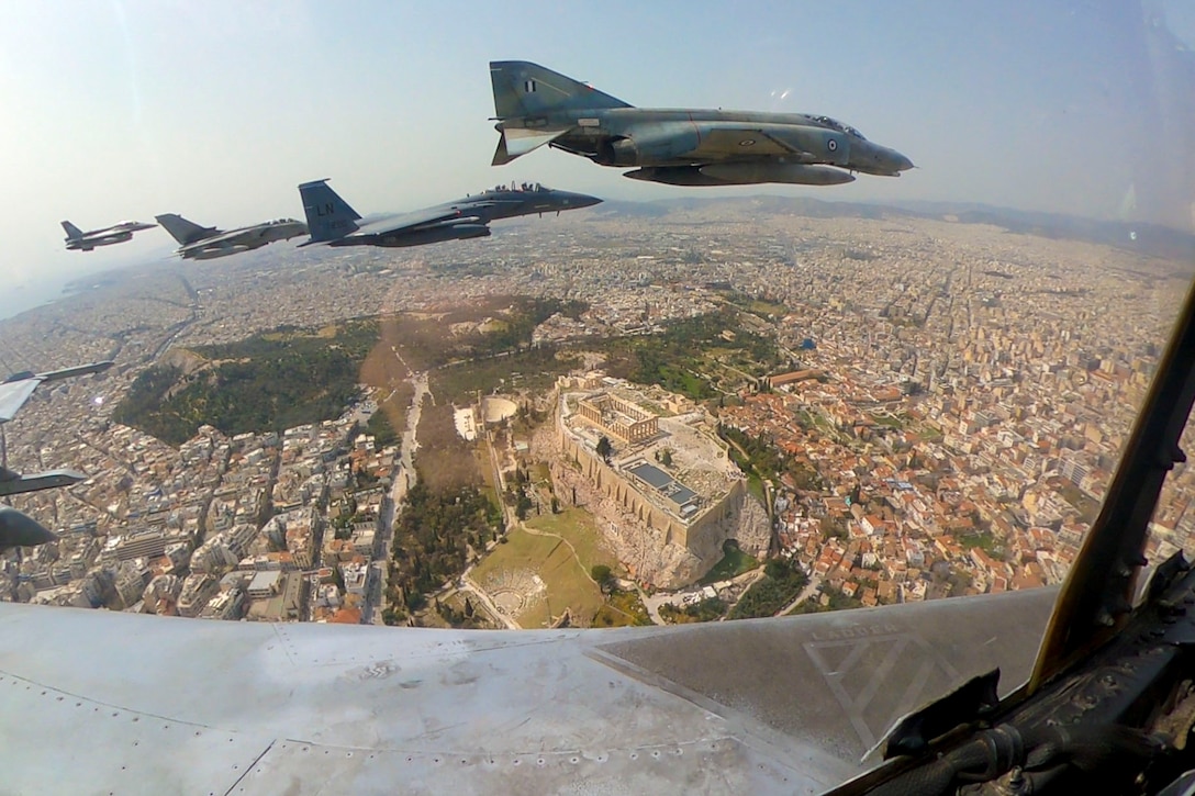 Four aircraft fly in formation.