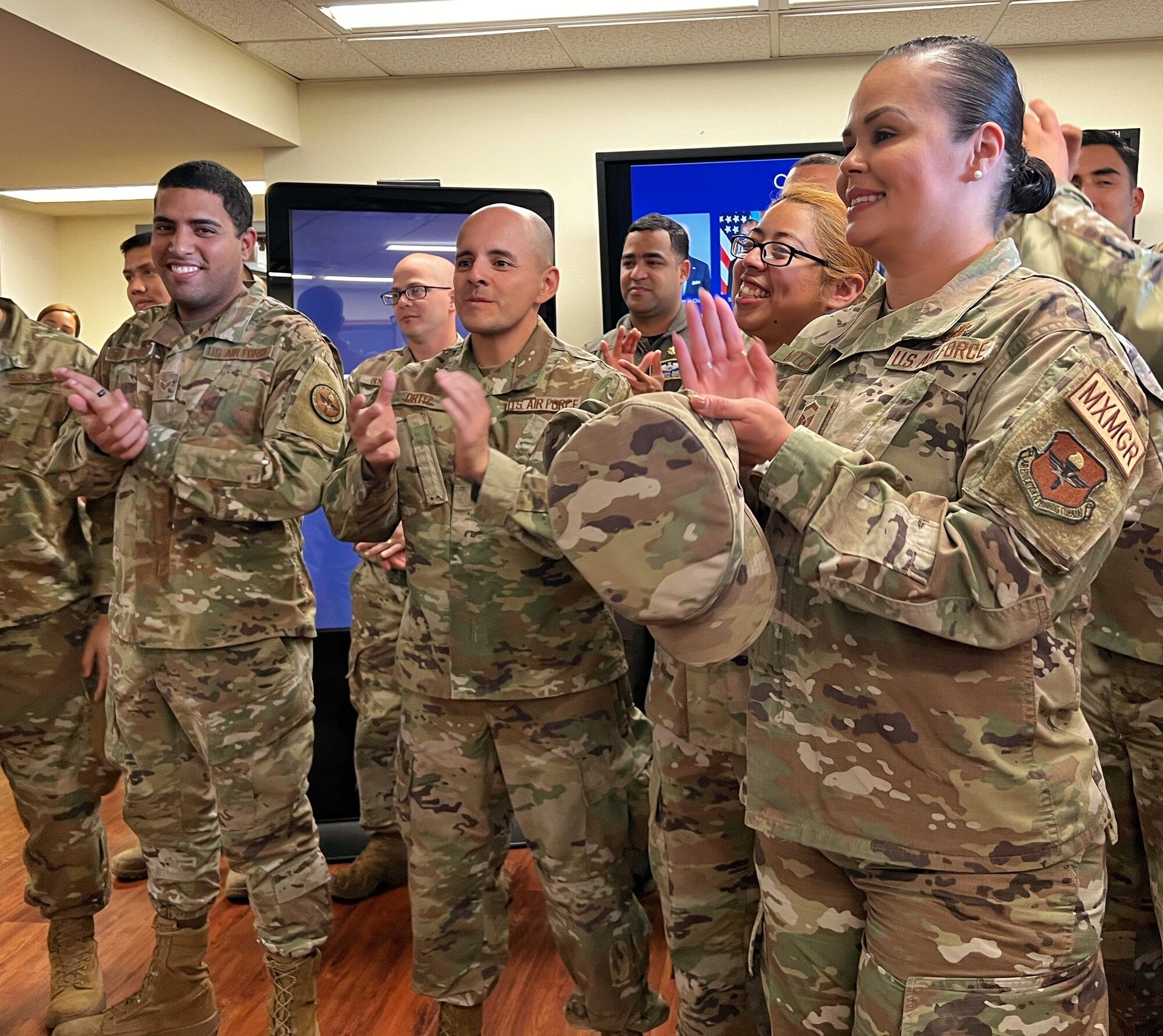 Airmen applaud as leaders cut ribbon for IAAFA heritage wall