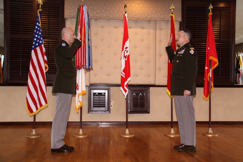Lt. Gen. Scott A. Spellmon, 55th chief of engineers and U.S. Army Corps of Engineers commanding general, administers the Oath of Office to Maj. Gen. Thomas J. Tickner during Tickner's promotion ceremony held April 7 at the Fort Hamilton Community Club.