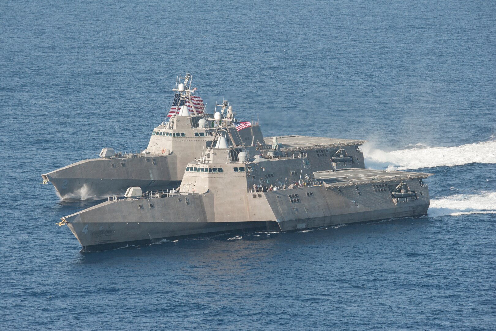 Two ships maneuver in the Pacific.