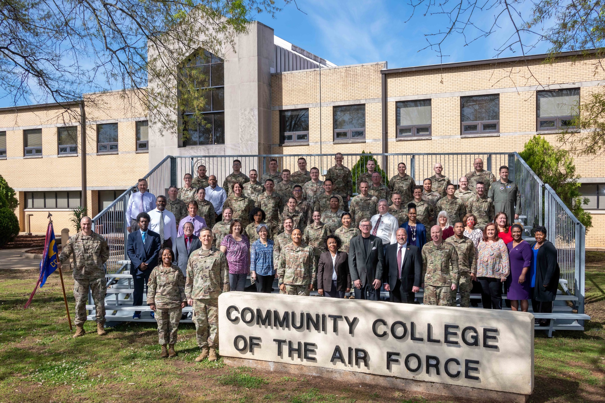 Lt. Col. Kevin Pond, Community College of the Air Force commandant, and staff members gather to open the CCAF time capsule in honor of its 50th anniversary, Apr. 1, 2022