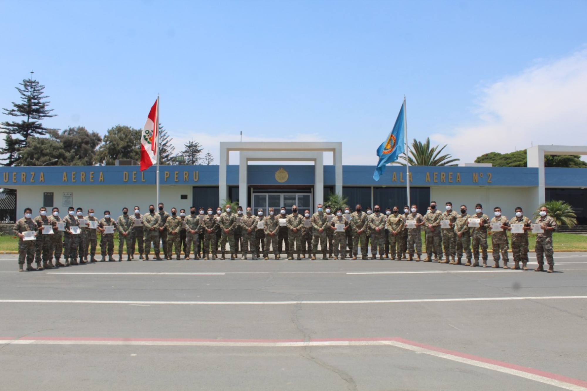 Air advisors with the 571st Mobility Support Advisory Squadron pose for a group photo alongside Peruvian Air Force Grupo 8 leadership and students following their graduation March 9, 2022, at Callao Air Base, Lima, Peru. This is the first training engagement air advisors have completed with the PERAF since the beginning of the pandemic. (Courtesy photo)