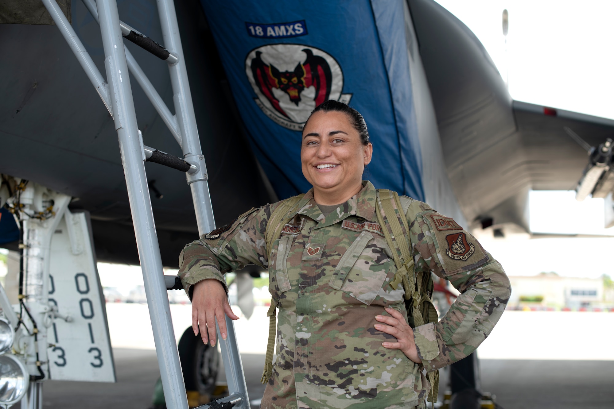 U.S. Air Force Staff Sgt. Linda Moreno, an independent duty medical technician assigned to the 44th Fighter Squadron, poses for a photo on the flightline at Kadena Air Base, Japan, April 4, 2022. An IDMT is an enlisted individual who is trained to provide health care in the absence of a physician at medical treatment facilities, and remote or deployed locations. (U.S. Air Force photo by Senior Airman Jessi Monte)