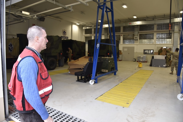 U.S. Army Corps of Engineers, Europe District Area Engineer August Carrillo walks through a recently renovated vehicle maintenance facility used by the U.S. Army’s V Corps on the Polish Army base in Poznan, Poland March 16, 2022. In Poznan, Europe District has managing renovation and construction efforts largely driven by the recent locating of V Corps’ forward element at the local base. (U.S. Army photo by Chris Gardner)
