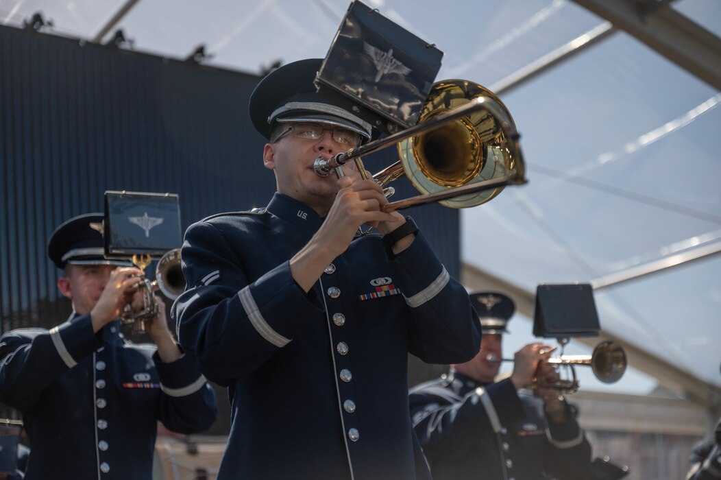 U.S. Air Force Airman 1st Class Evan Drumm, Band of the West member, plays the trombone during the National Medal of Honor Museum ceremony, March 25, 2022 at Arlington, Texas. The Band of the West in partnership with the Air National Guard Band of the Southwest, members from the Band of Mid America, and USAF Heritage of America band are unified to create the USAF Total Force Band to be part of this groundbreaking ceremony. (U.S. Air Force photo by Senior Airman Tyler McQuiston)
