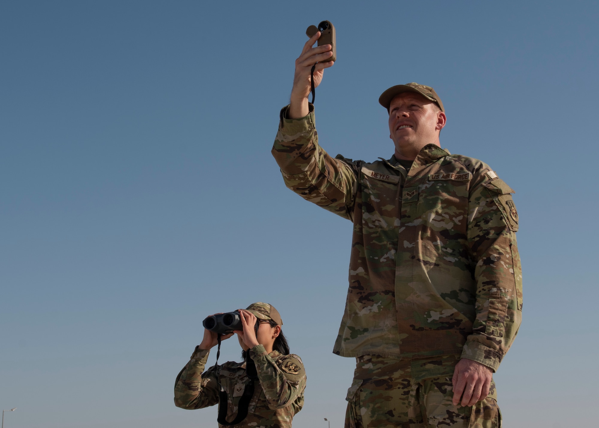 photo of airman using weather reading equipment