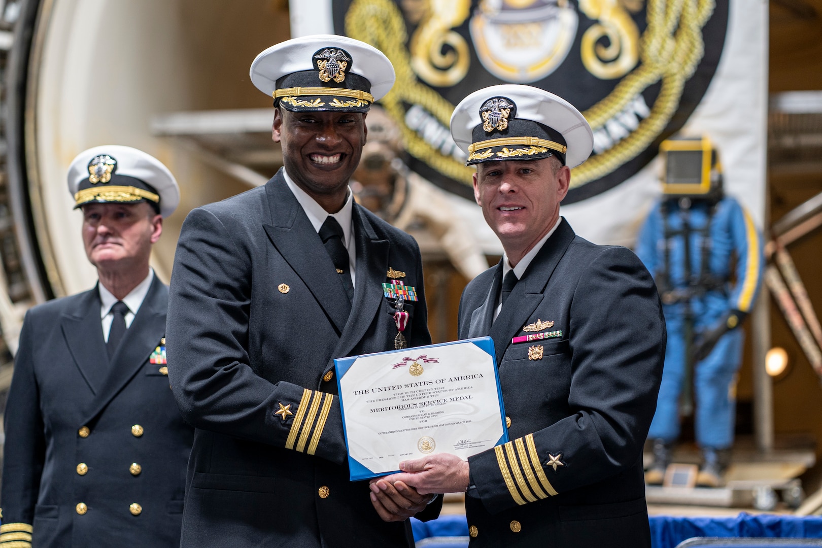 CAPT Jay Young presents CAPT (Sel) Kiah Rahming with the Navy Meritorious Service Medal for his incredible work as NEDU Commanding Officer.